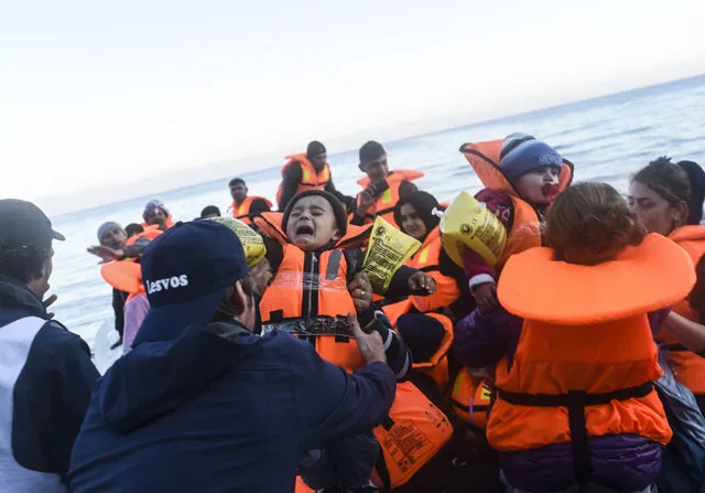 displaced iraqi people from the yazidi community who fled violence from islamic state is group look on following their arrival on the greek island of lesbos after crossing the aegean sea from turkey on november 14 2015 photo afp displaced iraqi people from the yazidi community who fled violence from islamic state is group look on following their arrival on the greek island of lesbos after crossing the aegean sea from turkey on november 14 2015 photo afp