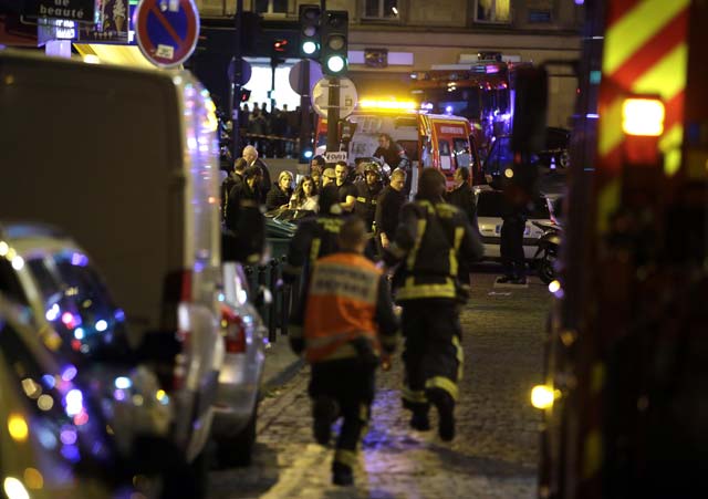 police and rescuers work at the scene of an attack in the 10th arrondissement of the french capital paris on november 13 2015 photo afp