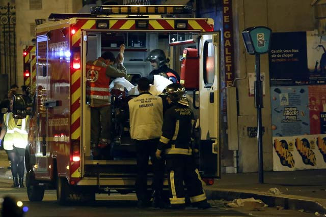rescue workers evacuate victims near la belle equipe rue de charonne at the site of an attack on paris on november 14 2015 after a series of gun attacks occurred across paris as well as explosions outside the national stadium where france was hosting germany photo afp rescue workers evacuate victims near la belle equipe rue de charonne at the site of an attack on paris on november 14 2015 after a series of gun attacks occurred across paris as well as explosions outside the national stadium where france was hosting germany photo afp