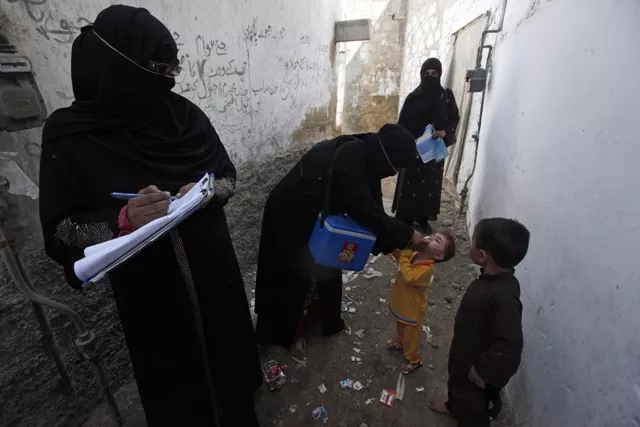 a file photo of health workers administrating polio vaccine to children photo reuters a file photo of health workers administrating polio vaccine to children photo reuters