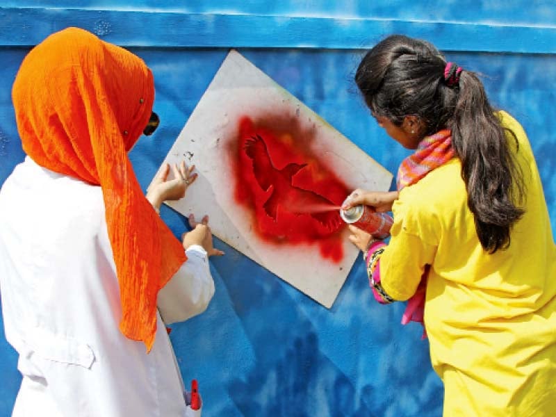 more than 150 students and volunteers of abdoz arts cleaned up the government site model school campus on friday and painted colourful and inspirational messages on its boundary walls photo aysha saleem express