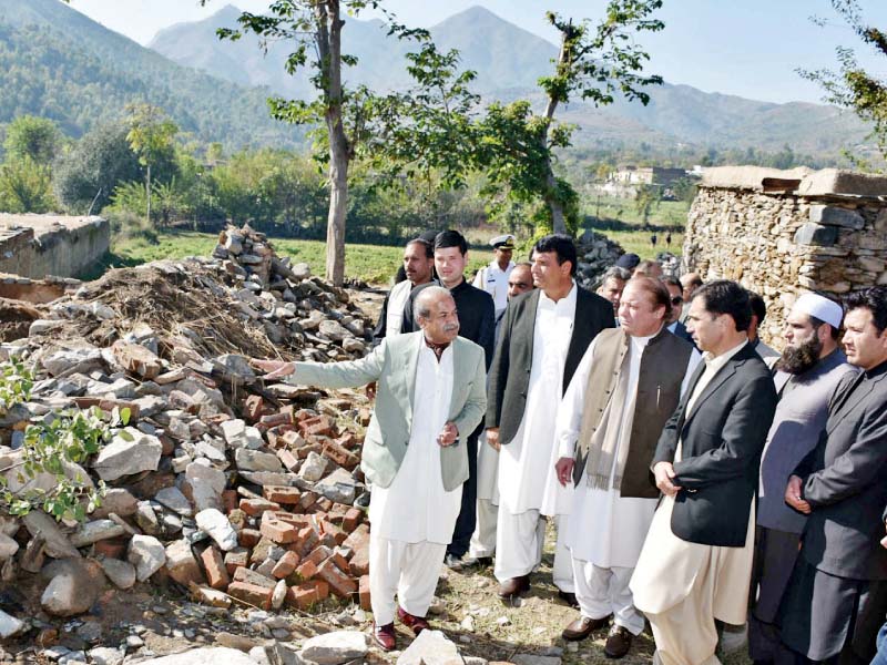 k p governor sardar mehtab briefs pm nawaz sharif about earthquake damage photo inp