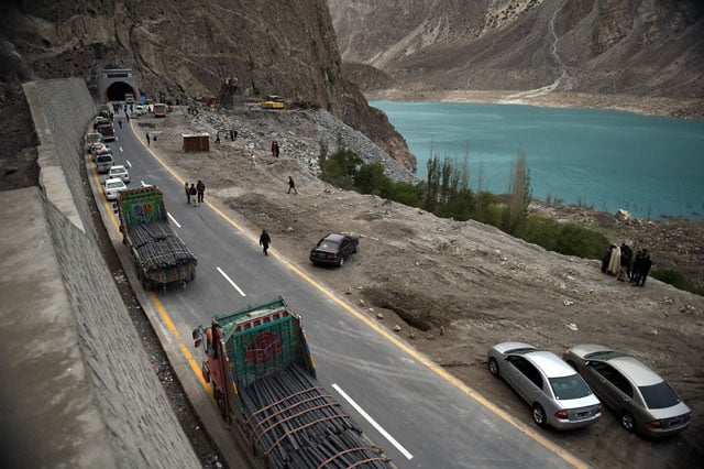 pakistani commuters wait to travel through a newly built tunnel in northern pakistan 039 s gojal valley photo afp