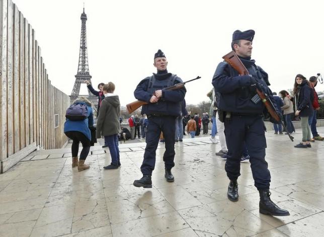 police patrol near the eiffel tower the day after a series of deadly attacks in paris photo reuters