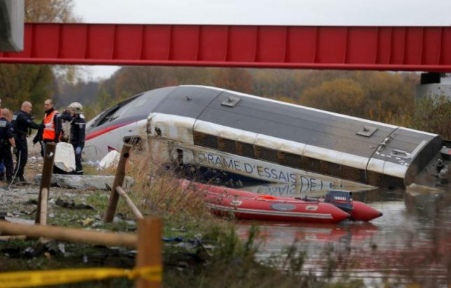 rescue workers search the wreckage of a test tgv train that derailed and crashed in a canal outside eckwersheim near strasbourg eastern france november 14 2015 photo reuters rescue workers search the wreckage of a test tgv train that derailed and crashed in a canal outside eckwersheim near strasbourg eastern france november 14 2015 photo reuters