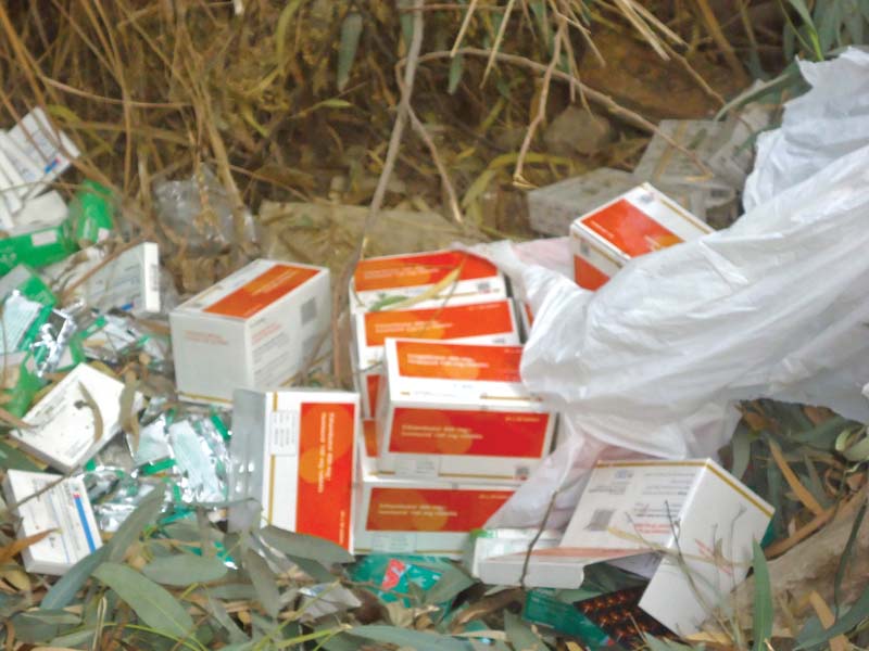 the medicine dumped by the store incharge was donated by unicef and should have been given to patients instead of keeping it hidden away photo express