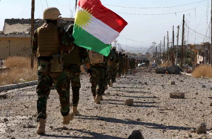 iraqi autonomous kurdish region 039 s peshmerga forces and fighters from yazidi minority holding kurdish flag while entering the northern iraqi town of sinjar on november 13 2015 photo afp