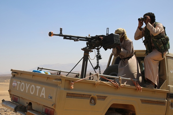 armed yemeni tribesmen supporting forces loyal to yemen 039 s saudi backed president fire from an armoured vehicle in the area of sirwah west of marib city on november 8 2015 photo afp