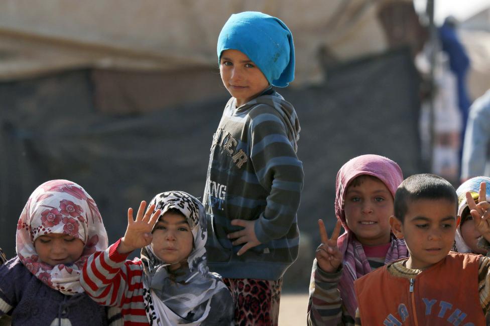 a photo of children rtying top escape the civil war in syria photo reuters