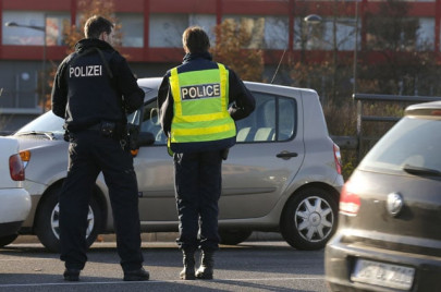 france police raid homes vow it s just the beginning