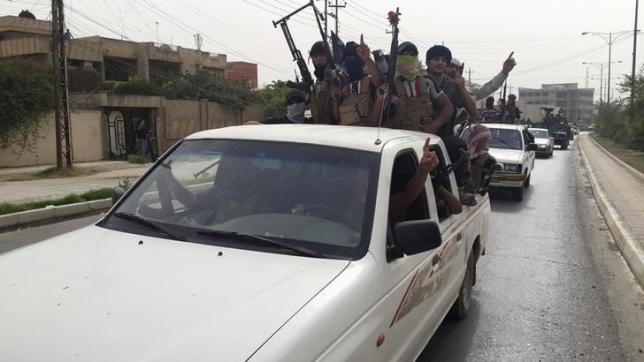 fighters of the islamic state celebrate on vehicles photo reuters