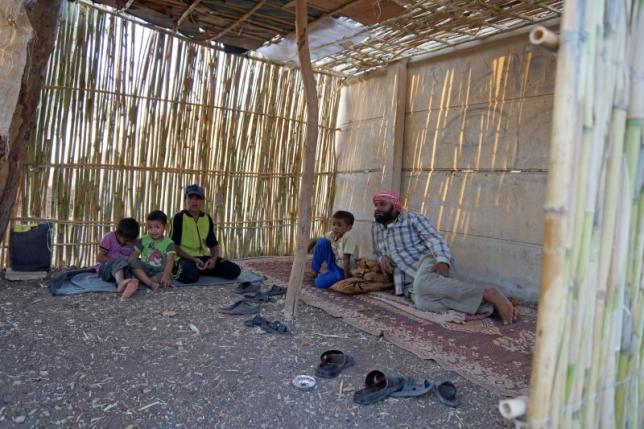 abu ahmad r rests with his children in a temporary summer room he built within a refugee camp that was formerly the zeyzoun vanguards summer camp for school children in zeyzoun village deraa region syria august 6 2015 photo reuters