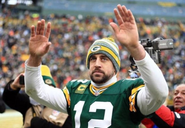 green bay packers quarterback aaron rodgers 12 waves to the crowd after the 2014 nfc divisional playoff football game against the dallas cowboys at lambeau field jan 11 2015 green bay wi usa photo andrew weber usa today sports green bay packers quarterback aaron rodgers 12 waves to the crowd after the 2014 nfc divisional playoff football game against the dallas cowboys at lambeau field jan 11 2015 green bay wi usa photo andrew weber usa today sports
