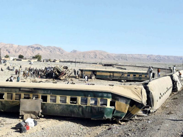 rescue officials inspect the damaged carriages of the derailed train photo afp rescue officials inspect the damaged carriages of the derailed train photo afp
