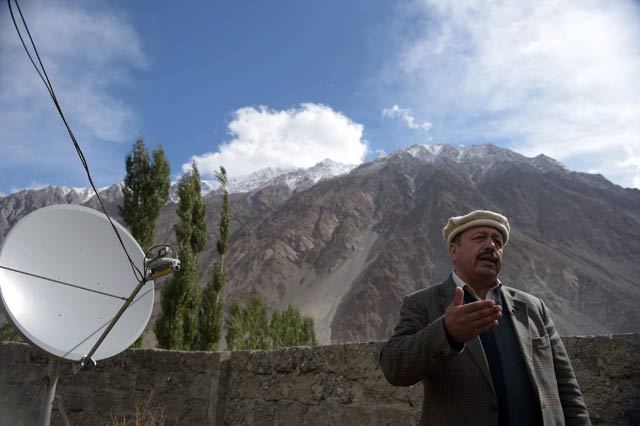 abdul waheed the project director of an e facility center speaks during an interview with afp in the village of gulmit hunza valley in northern pakistan photo afp