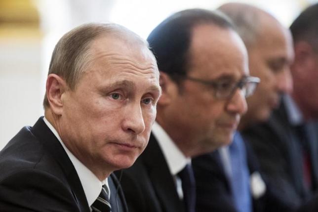 russian president vladimir putin l and french president francois hollande sit together at the start of a summit on ukraine at the elysee palace in paris france october 2 2015 photo reuters