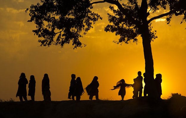 displaced children from tribal areas play under a tree during a sunset near islamabad photo b k bangash ap