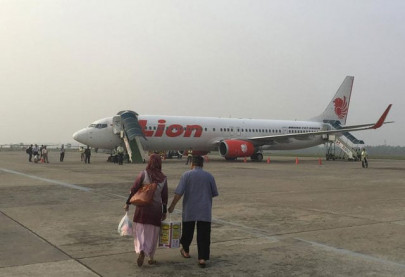 indonesian pilot grounded for offering hostess as compensation