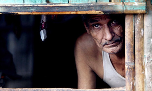 a bhutanese refugee shopkeeper looks out from his shop at the beldangi ii refugee camp 300km south east of kathmandu photo afp