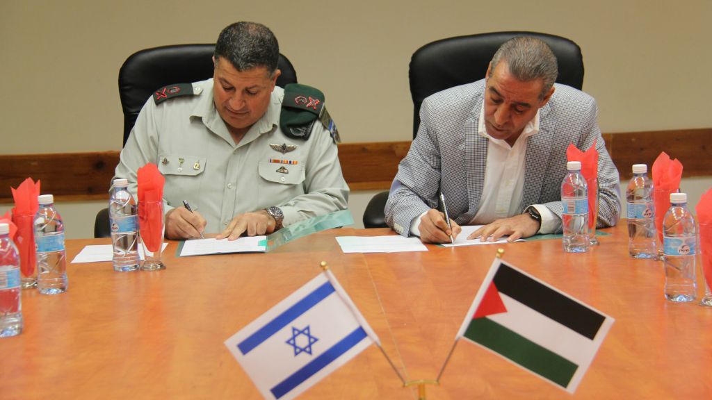 palestinian minister of civil affairs hussein al sheikh right and israel 039 s coordinator of government activities in the territories maj gen yoav mordechai sign on november 19 a memorandum of understanding that officials said could mean 3g service in palestinian areas in three to six months photo idf