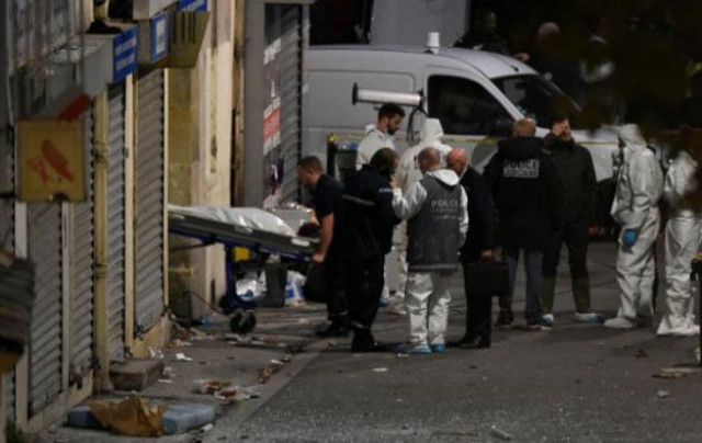 a body is removed from the apartment raided by french police special forces in the northern paris suburb of saint denis on november 18 2015 photo afp a body is removed from the apartment raided by french police special forces in the northern paris suburb of saint denis on november 18 2015 photo afp