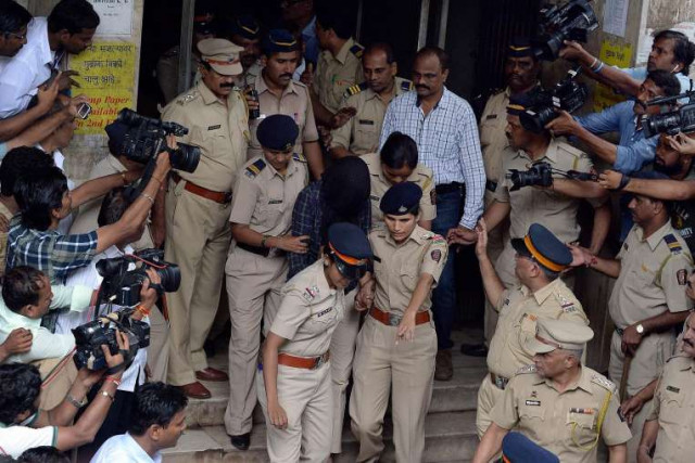indian police escort former media executive indrani mukherjea from a city court in mumbai on aug 31 2015 photo afp