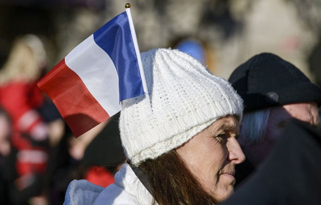 a woman wears a french flag on her bonnet as she attends a public tribute to the victims of the november 13 series of deadly attacks in paris at the gustaf adolfs square in central stockholm sweden on november 21 2015 photo afp a woman wears a french flag on her bonnet as she attends a public tribute to the victims of the november 13 series of deadly attacks in paris at the gustaf adolfs square in central stockholm sweden on november 21 2015 photo afp