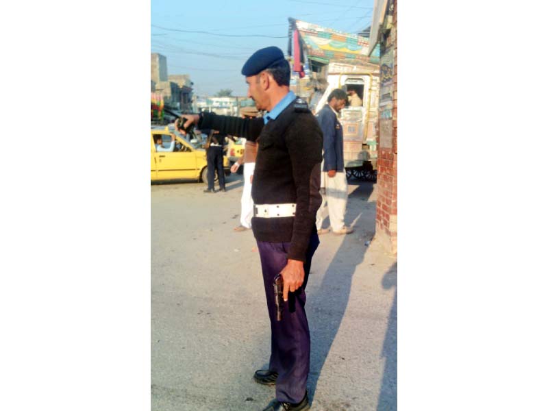 a traffic officers policing an intersection in shabqadar photo express