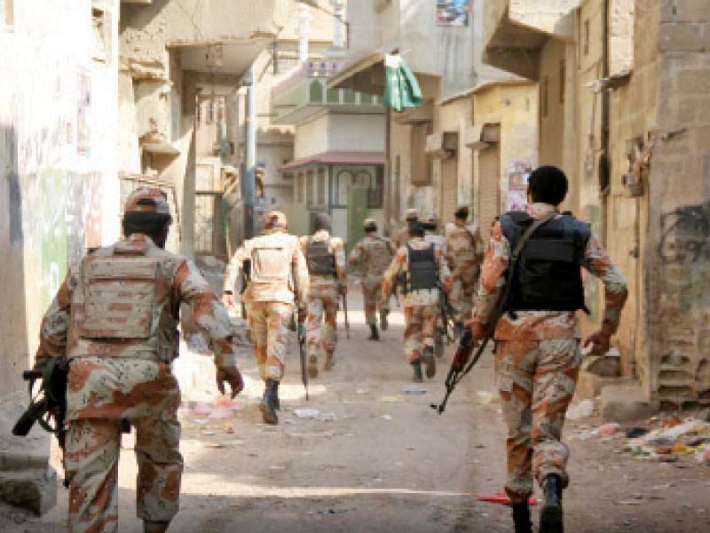 rangers personnel cordon off the area during a search operation in pak colony after four people were shot and killed by unknown assailants photo online