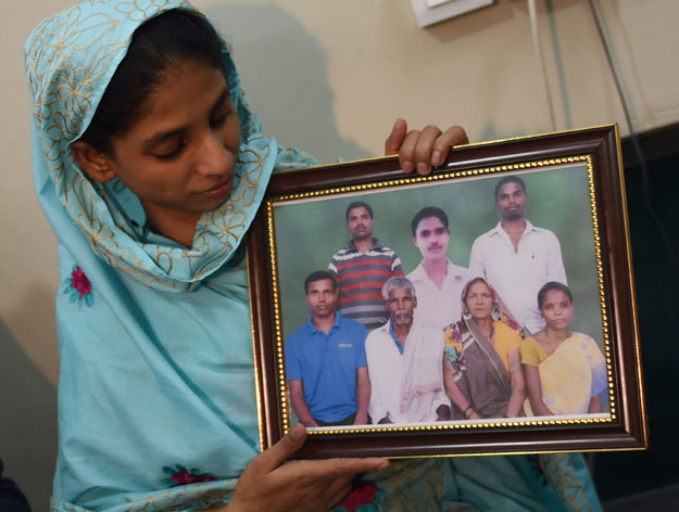 geeta holds a photograph possibly of her family at the edhi foundation in karachi photo afp