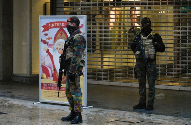 soldiers patrol a pedestrian shopping street in brussels on november 21 2015 with the belgian capital in lock down as authorities hunted for several suspects linked to the paris attacks photo afp