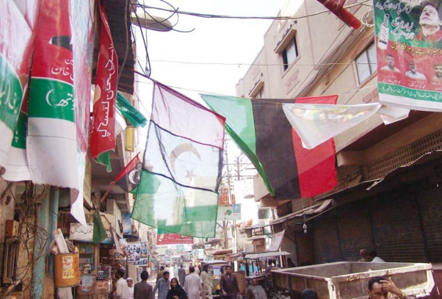 flags of different political parties being displayed on the roads in lyari ahead of local bodies polls which are scheduled for december 5 in the city photo ppi flags of different political parties being displayed on the roads in lyari ahead of local bodies polls which are scheduled for december 5 in the city photo ppi