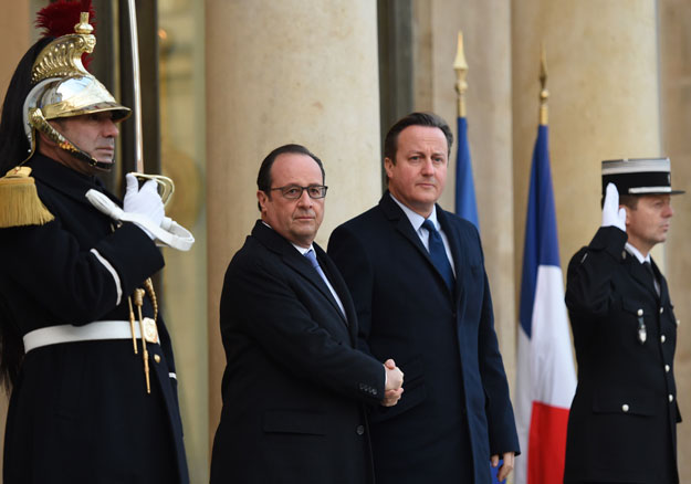 french president francois hollande l shakes hands with british prime minister david cameron on november 23 2015 at the elysee presidential palace in paris whom he receives for talks on anti terror coordination in the wake of the paris attacks photo afp