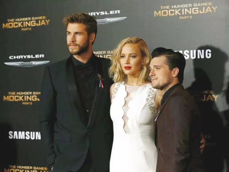 cast members liam hemsworth l jennifer lawrence c and josh hutcherson r pose at the premiere of the hunger games mockingjay part 2 in los angeles photo reuters cast members liam hemsworth l jennifer lawrence c and josh hutcherson r pose at the premiere of the hunger games mockingjay part 2 in los angeles photo reuters