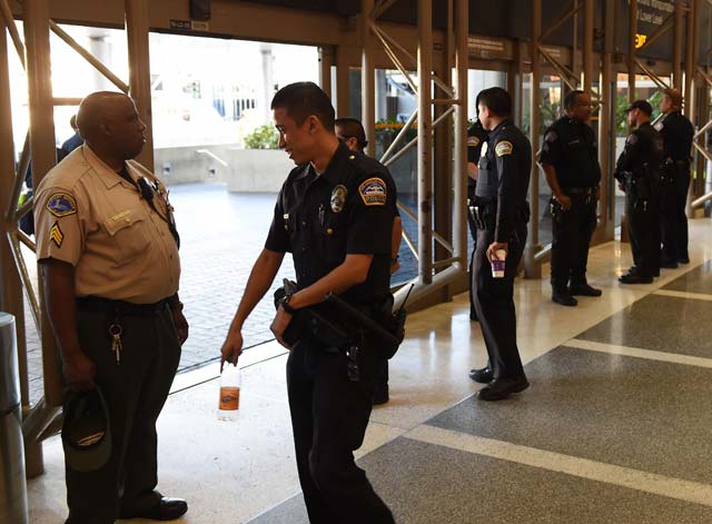 police keep watch over passengers at los angeles international airport after the us state department issued a worldwide travel alert warning us citizens of the heightened risks of traveling due to quot increased terrorist threats quot november 23 2015 in los angeles california photo afp