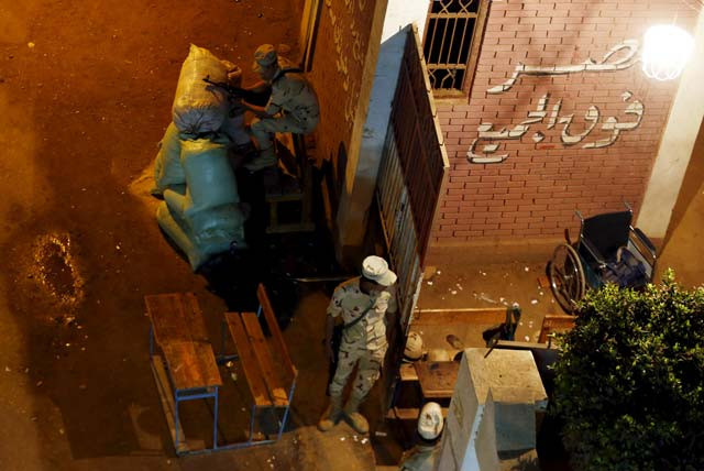 soldiers stand guard outside a school being used as a polling station after they closed during the second round of parliamentary election in toukh el kalubia governorate northeast of cairo egypt november 23 2015 on the final day of voting in egypt 039 s two phase parliamentary elections egyptians voted on sunday in the second phase of elections that are meant to restore parliament after a more than three year hiatus but which critics say have been undermined by widespread repression photo reuters soldiers stand guard outside a school being used as a polling station after they closed during the second round of parliamentary election in toukh el kalubia governorate northeast of cairo egypt november 23 2015 on the final day of voting in egypt 039 s two phase parliamentary elections egyptians voted on sunday in the second phase of elections that are meant to restore parliament after a more than three year hiatus but which critics say have been undermined by widespread repression photo reuters