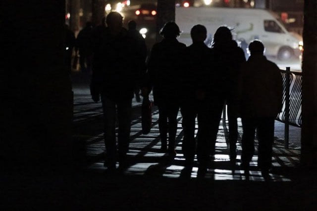 people walk along a street during a power outage in the crimean city of simferopol on november 23 2015 photo afp people walk along a street during a power outage in the crimean city of simferopol on november 23 2015 photo afp
