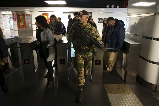 an italian army soldier patrols at the termini train station in downtown rome november 23 2015 as security is tightened after deadly attacks in paris on november 13 photo reuters