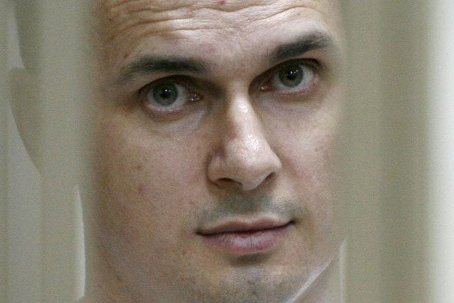 ukrainian film director oleg sentsov looks out from a defendants 039 cage during a hearing at a military court in the russian city of rostov on don on july 21 2015 photo afp ukrainian film director oleg sentsov looks out from a defendants 039 cage during a hearing at a military court in the russian city of rostov on don on july 21 2015 photo afp