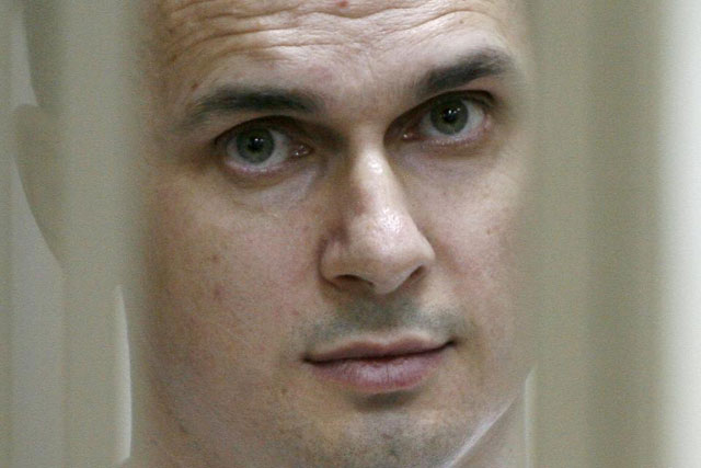 ukrainian film director oleg sentsov looks out from a defendants 039 cage during a hearing at a military court in the russian city of rostov on don on july 21 2015 photo afp