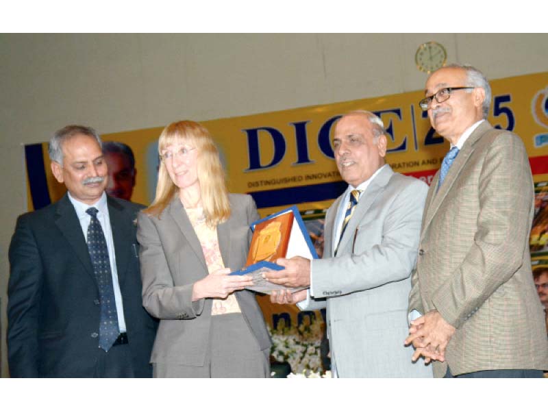 governor malik rafique rajwana presents a shield to german ambassador to pakistan ina lepel at uaf on tuesday photo express