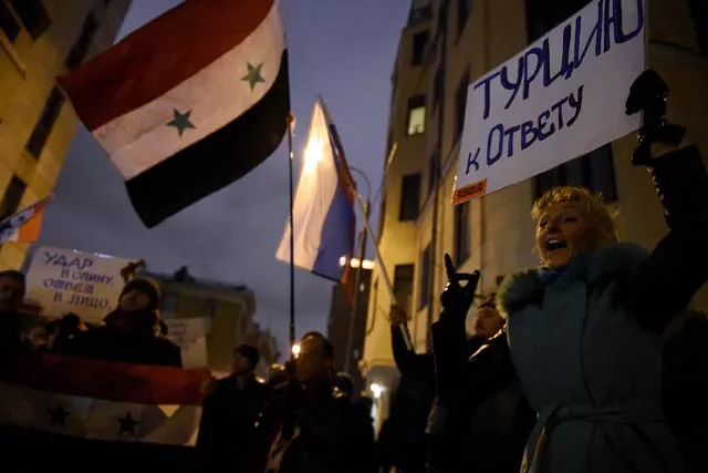 a woman holds a placard reading quot bring turkey to account quot as she and others gather outside the turkish embassy in moscow on november 24 2015 nato member turkey shot down a russian war plane on the syrian border on november 24 an act president vladimir putin denounced as a quot stab in the back quot by quot accomplices of terrorists quot as tensions spiralled between two rival players in the syria war photo afp a woman holds a placard reading quot bring turkey to account quot as she and others gather outside the turkish embassy in moscow on november 24 2015 nato member turkey shot down a russian war plane on the syrian border on november 24 an act president vladimir putin denounced as a quot stab in the back quot by quot accomplices of terrorists quot as tensions spiralled between two rival players in the syria war photo afp