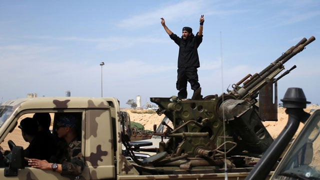 a fighter from misrata shouts to his comrades as they move to fight islamic state militants near sirte photo reuters a fighter from misrata shouts to his comrades as they move to fight islamic state militants near sirte photo reuters