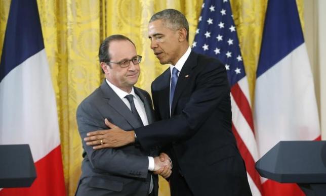 us president barack obama r greets french president francois hollande during a joint news photo reuters