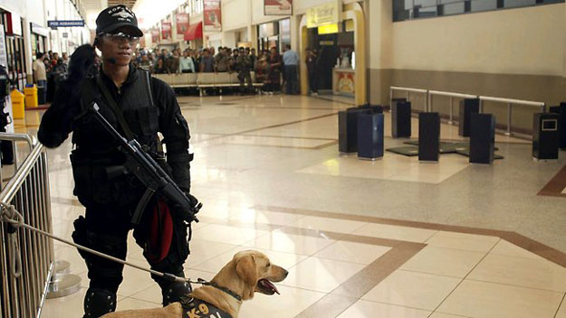 an indonesian navy soldier stands guard at junda international airport after the discovery of explosive materials grounded a garuda flight photo afp