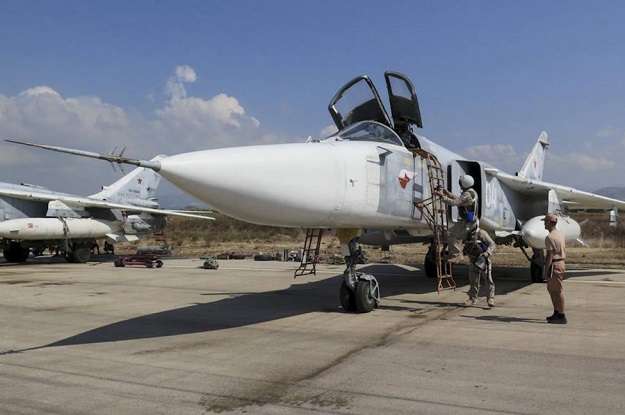 pilots of a russian sukhoi su 24 fighter jet prepare before a flight at the hmeymim air base near latakia syria in this handout photograph released by russia 039 s defence ministry october 5 2015 photo reuters