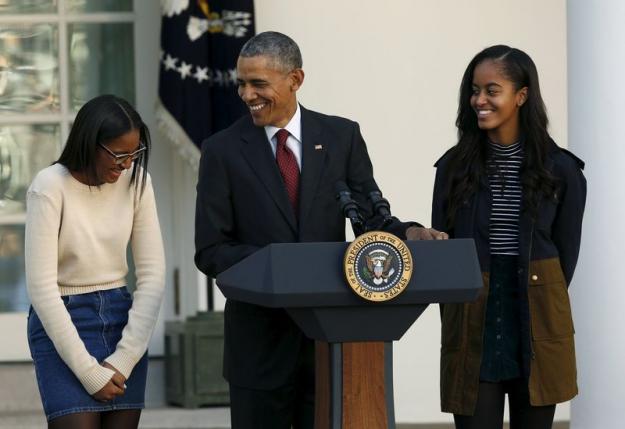 united states president barack obama along with daughters sasha l and malia r attends the 68th annual pardoning of thanksgiving turkey abe not pictured in the rose garden of the white house in washington november 25 2015 photo reuters