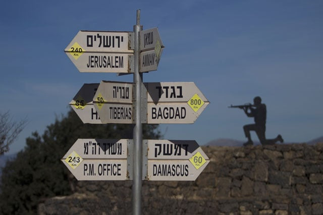 a sculpture of an israeli soldier standing guard is seen on november 25 2015 next to a sign for tourists showing the distance to damascus and baghdad at an army post on mount bental in the israeli annexed golan heights in the area from which an israeli arab reportedly paraglided into syria to join an islamic state affiliated group photo afp a sculpture of an israeli soldier standing guard is seen on november 25 2015 next to a sign for tourists showing the distance to damascus and baghdad at an army post on mount bental in the israeli annexed golan heights in the area from which an israeli arab reportedly paraglided into syria to join an islamic state affiliated group photo afp