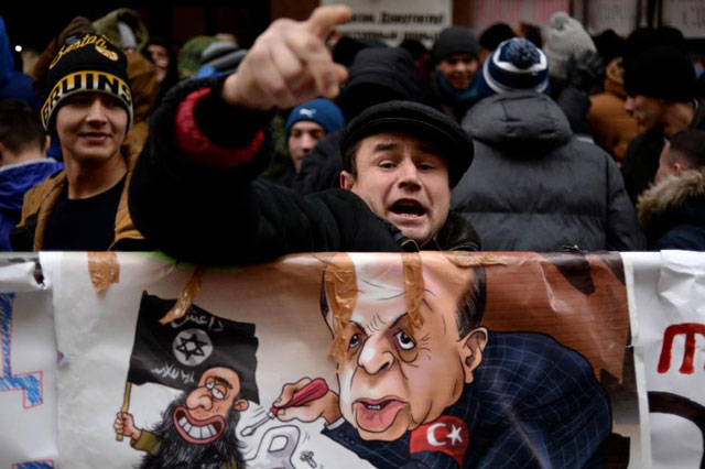 a protester shouts slogans during a demonstration in front of the turkish embassy in moscow on november 25 2015 photo afp