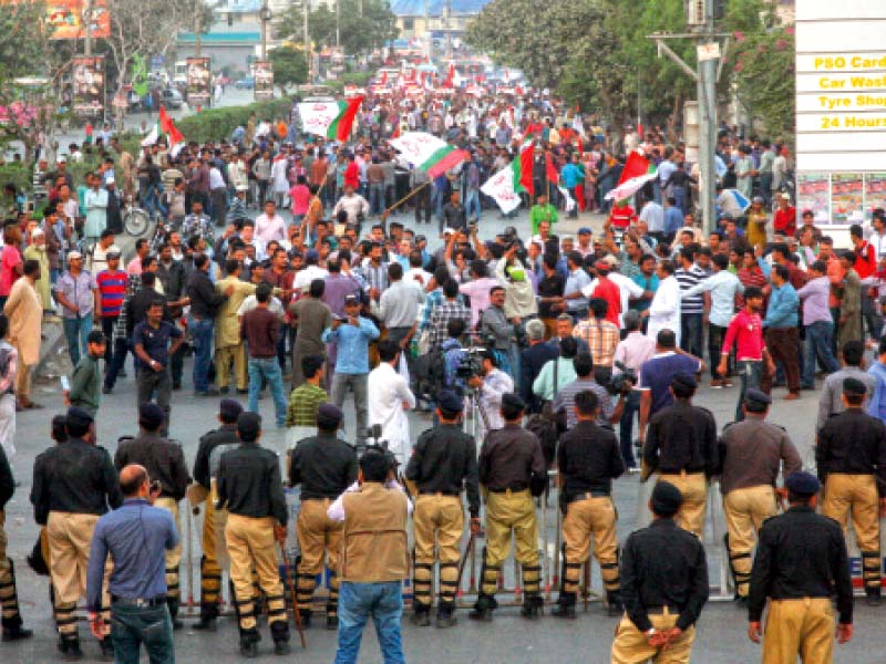 the police erected barriers to prevent the supporters of the mqm from marching towards the rangers headquarters on thursday evening the party leaders decided to continue their demonstration at numaish chowrangi photo athar khan express